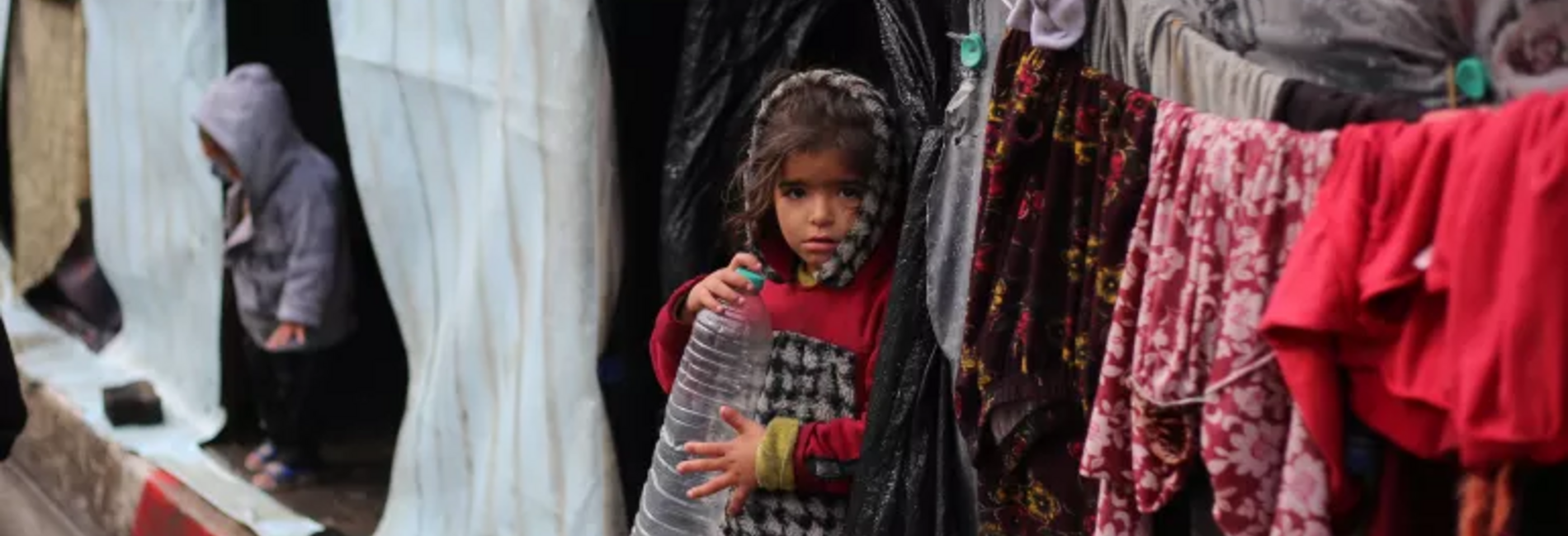 Displaced children outside their improvised shelters in Gaza. Photo by UNICEF/El Baba