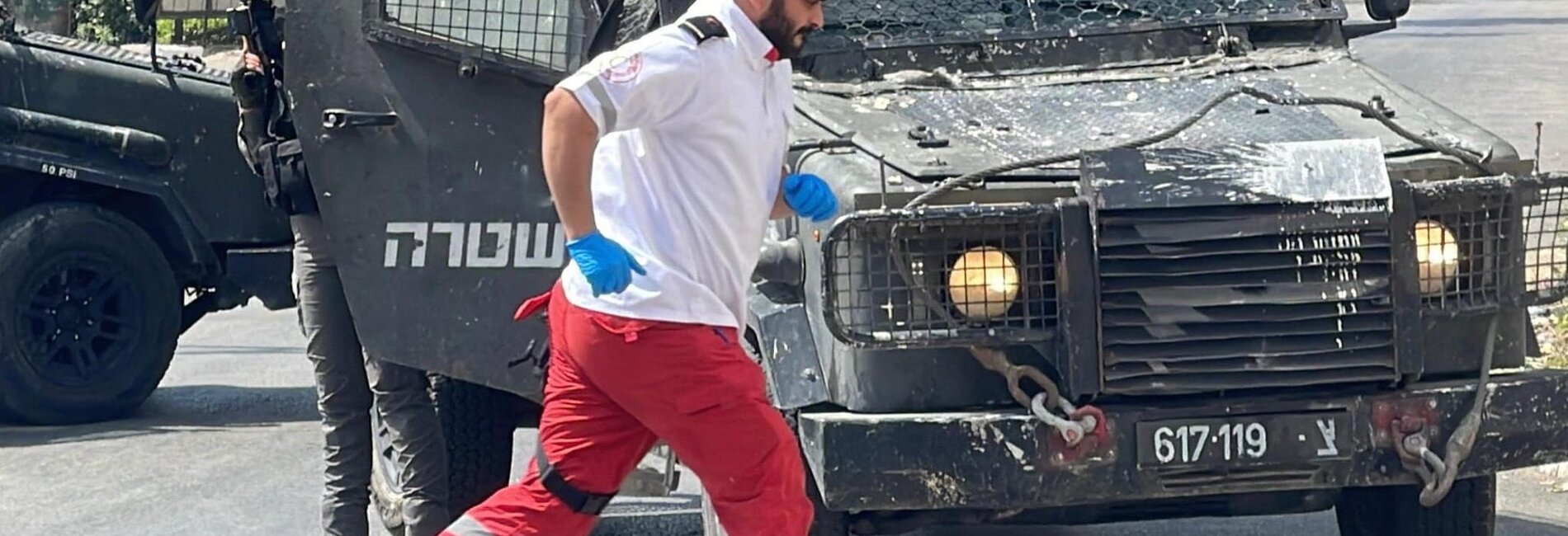 A medic with the Palestine Red Crescent Society rushing to treat wounded people in Nablus city during an Israeli operation, 27 August 2025. Photo by Abdullah Bahash