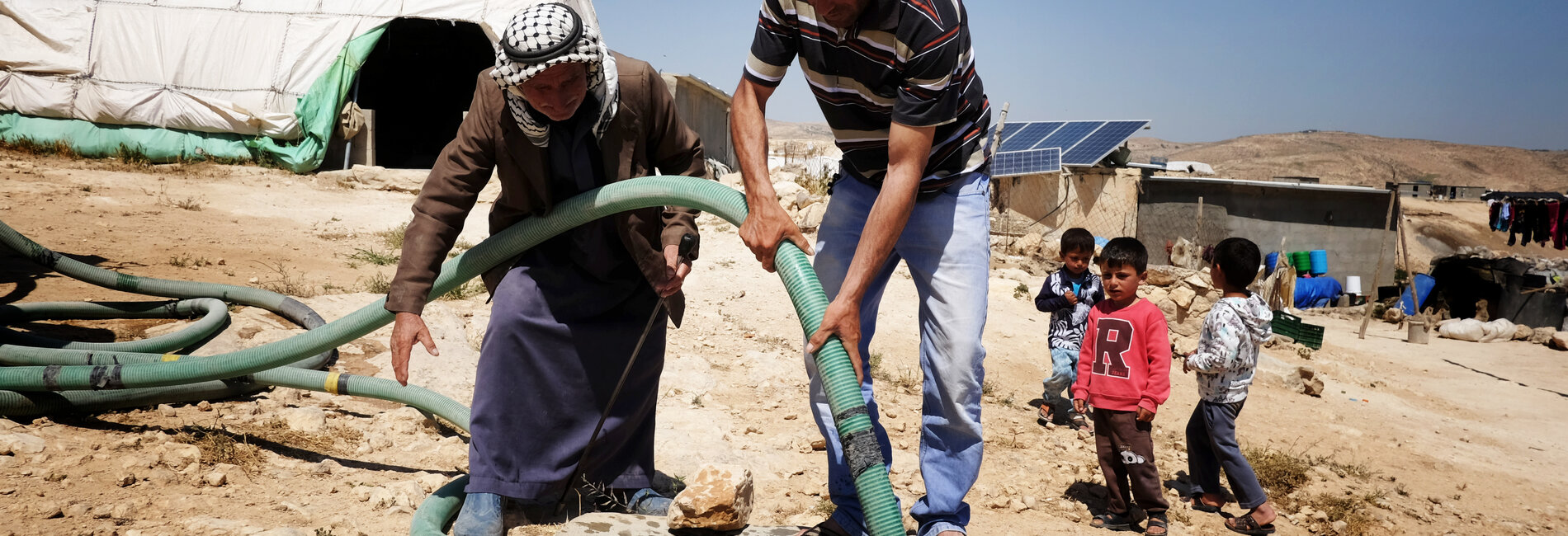 Palestinians in an Area C community of the West Bank not connected to the water grid. Archive picture by OCHA