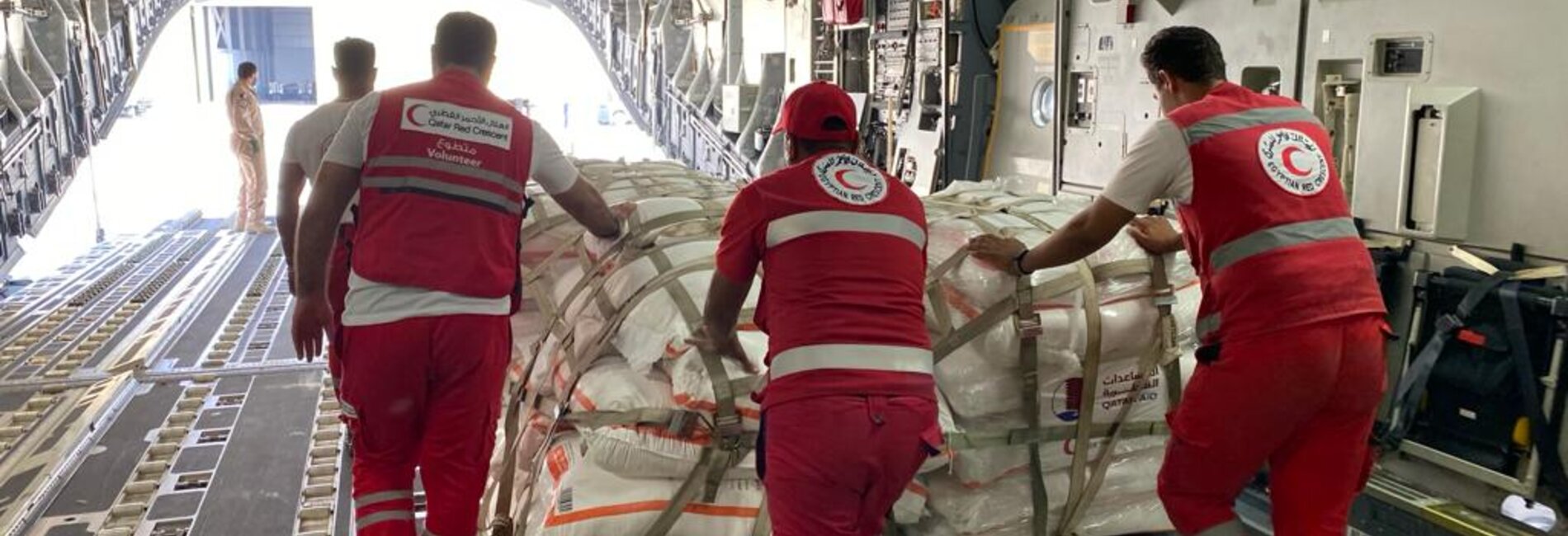 A logistics team from the Egyptian Red Crescent Society in Al Arish airport, Egypt, organizing and preparing humanitarian aid for transport into Gaza. Photo by the Egyptian Red Crescent Society