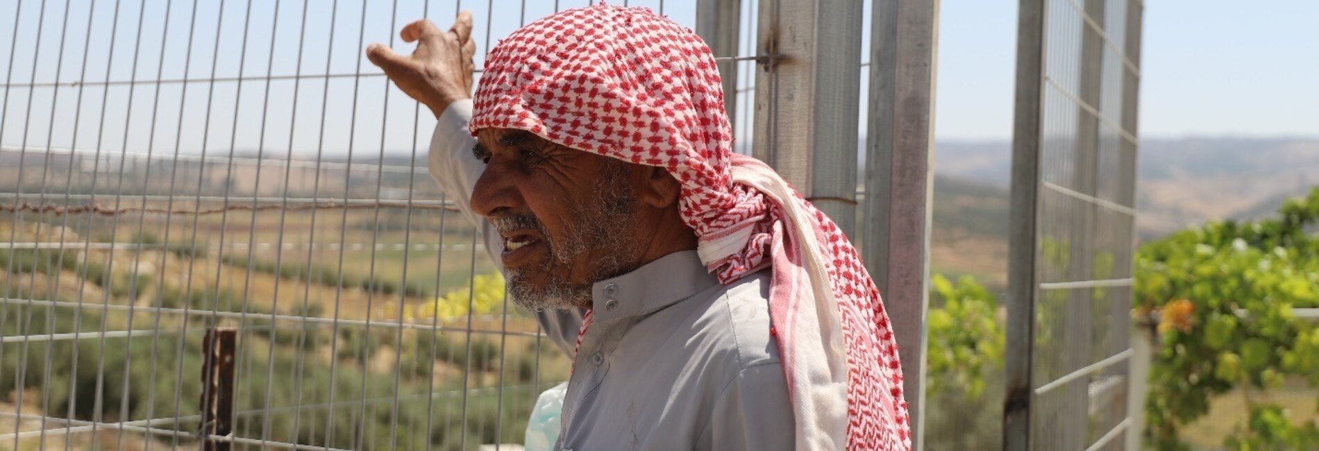 Abu Waleed, farmer and leader of the Queela community, near his house. Photo: ACF