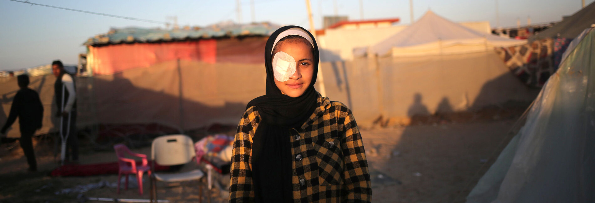 Abrar, 15-year-old, who was hit by shrapnel. “When my house was bombed and destroyed, two of my brothers were killed, and a third one was injured. Some shrapnel hit my right eye, causing weak eyesight and constant tears.” Photo by UNICEF