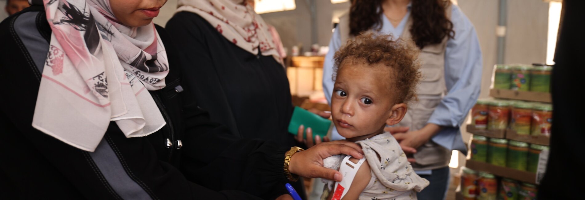 A Palestinian child being screened for malnutrition in Khan Younis, as new supplies arrived following almost 80 days of full blockade on any cargo entering the Gaza Strip. Photo by UNICEF, 25 May 2025 