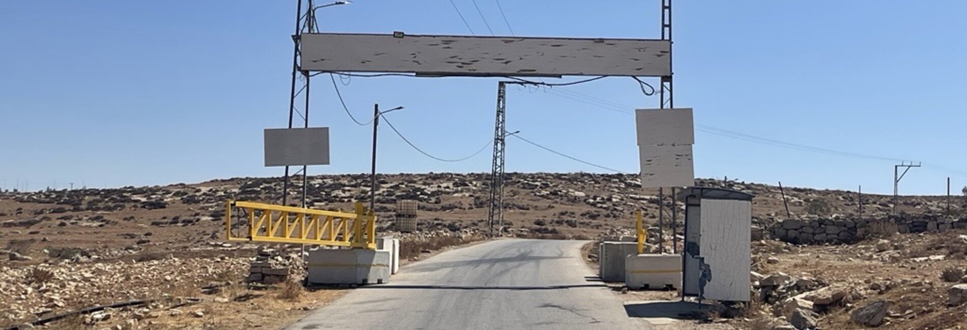 An iron gate near the Palestinian village of Al Buweib, in Hebron governorate, one of 27 closures installed by Israeli forces in the first half of September across the West Bank, risking further disruption of access to services, workplaces and key road arteries. Photo by OCHA 