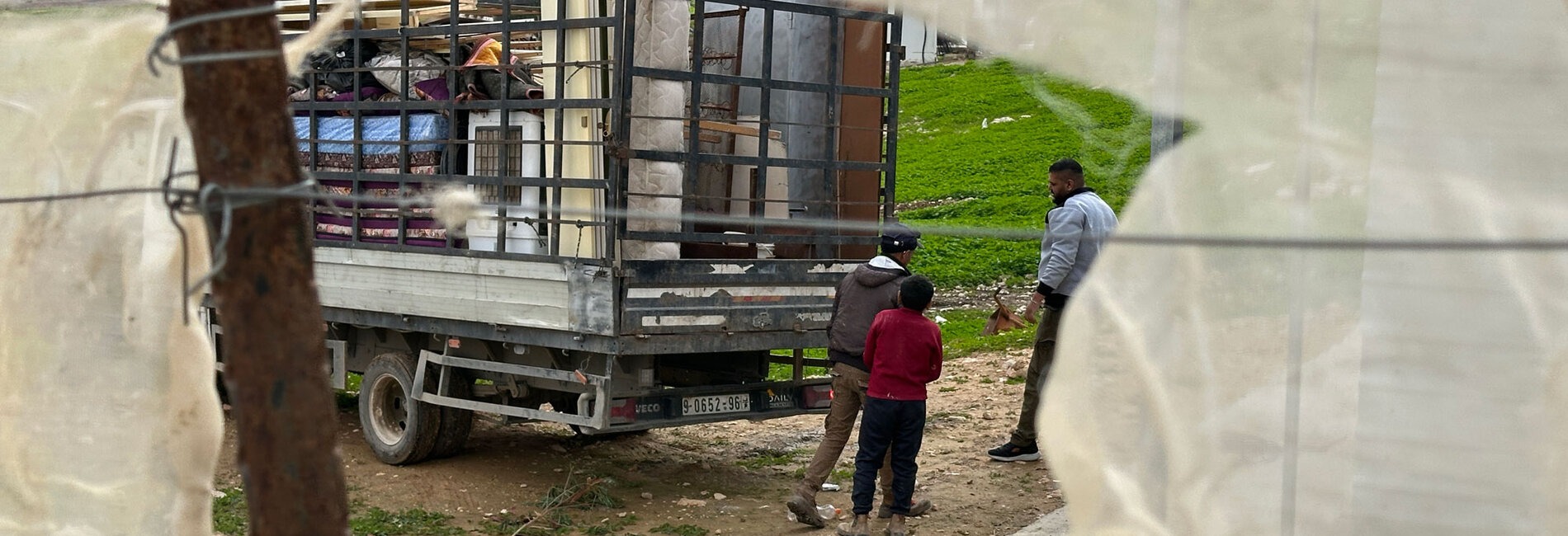 Residents of the Palestinian Bedouin community of Ras Ein al ‘Auja preparing to leave following repeated attacks, threats and acts of intimidation by Israeli settlers. Photo by OCHA