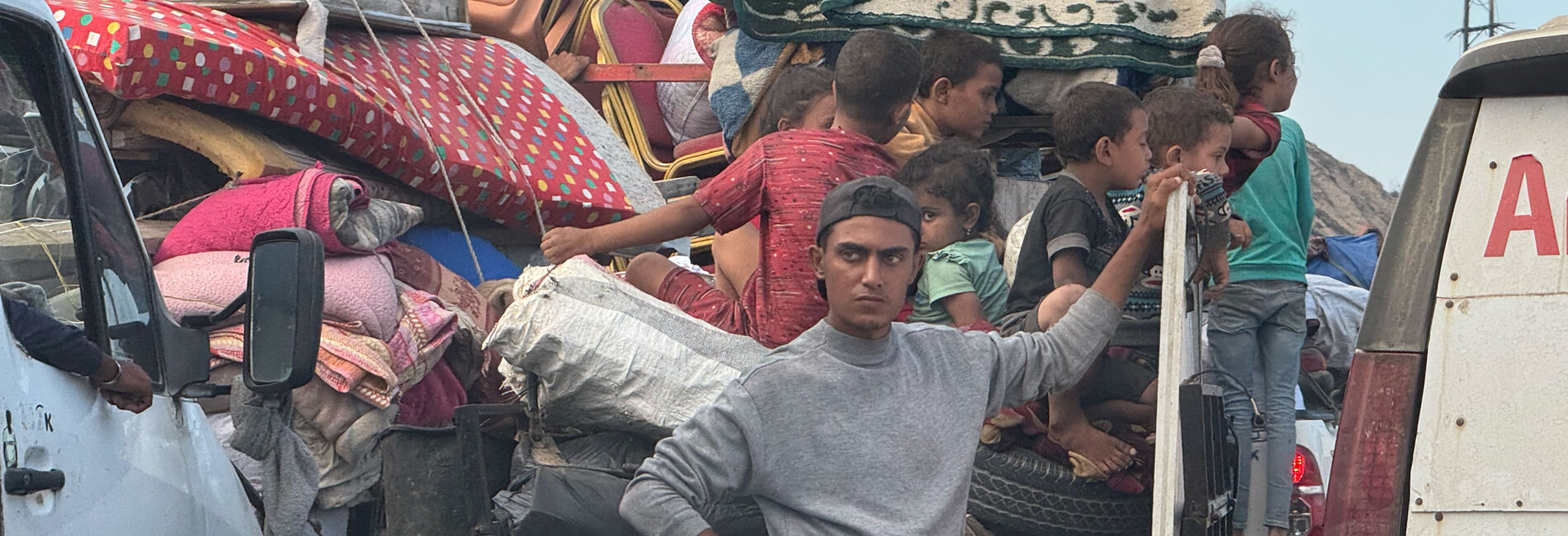 Palestinians displaced from Gaza city wait in heavy traffic on Al Rashid Road leading south. Photo by OCHA/Olga Cherevko