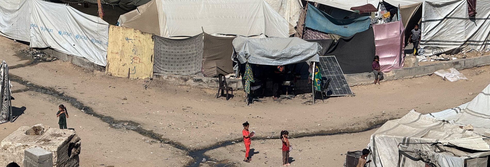 Palestinian children in a displacement site established in Gaza city, 18 June 2025. Photo by OCHA/Olga Cherevko