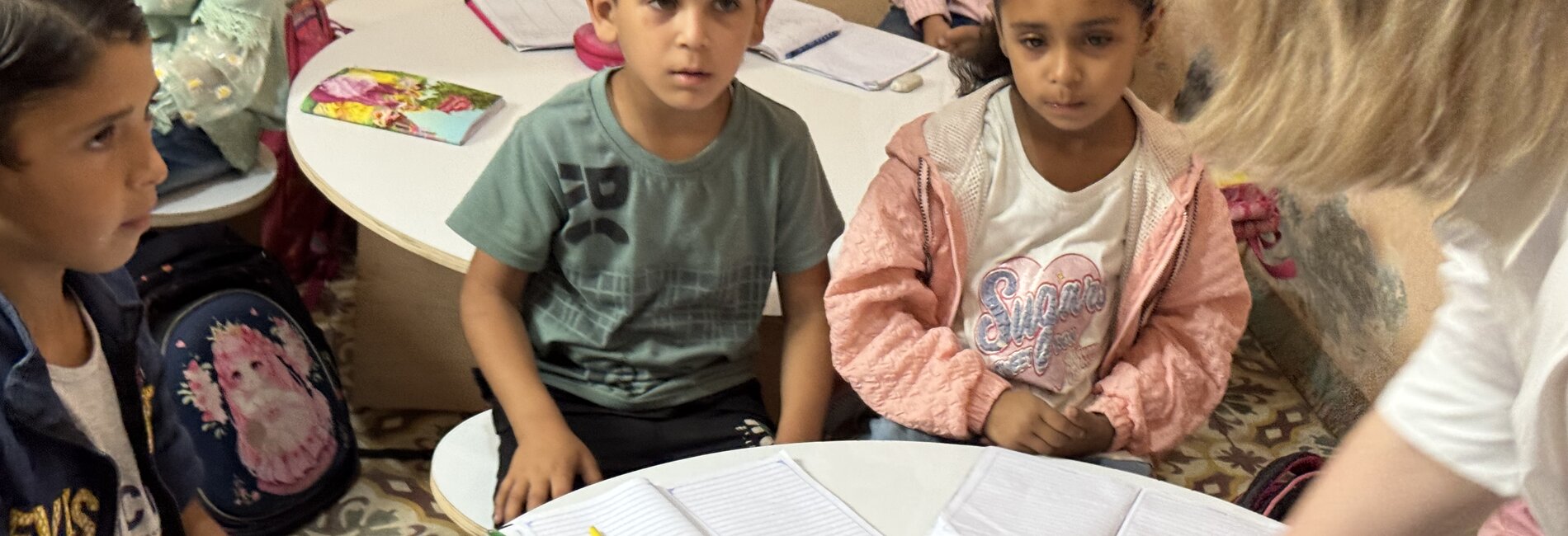 Children in Khan Younis attending one of 219 temporary learning spaces set up as alternatives to formal schools, currently serving 117,000 learners. Photo by OCHA/Olga Cherevko