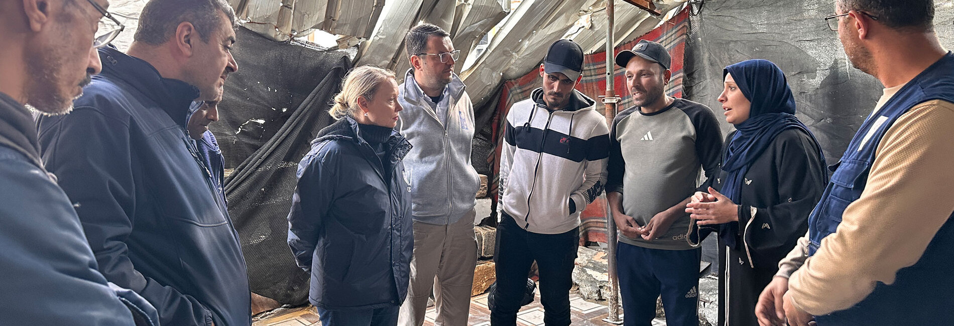 UN team, led by the Deputy Humanitarian Coordinator, speaks with one of the families in Khan Younis as part of ongoing assessments to guide lifesaving assistance. Photo: OCHA 