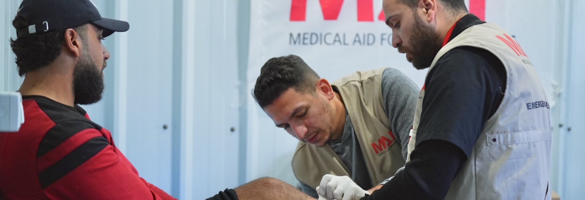 Ibrahim with a Medical Aid for Palestinians team. Photo by Palm Media for Medical Aid for Palestinians 
