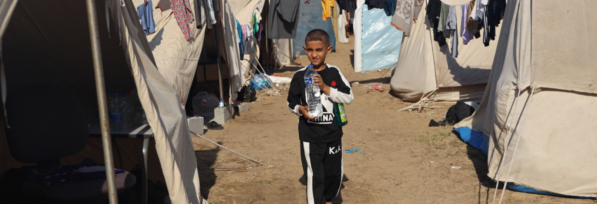 Majed (9), in a tent camp in Khan Younis following his displacement from Beit Hanoun. His home is said to have been destroyed after the family left. “I wish all of this was over. We’re tired of wars. What we need now is water and food. The amounts we get aren’t enough. We eat only once a day.” Photo by UNICEF/El Baba, 15 November 2023