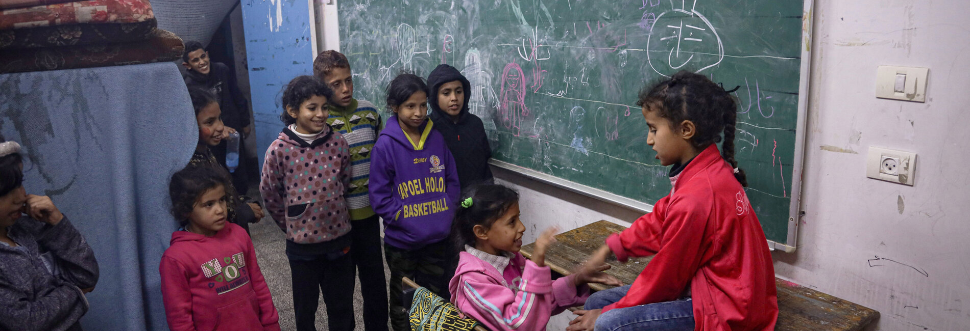 Children at a school used as a shelter for internally displaced persons in Rafah city. Photo by UNICEF/El Baba