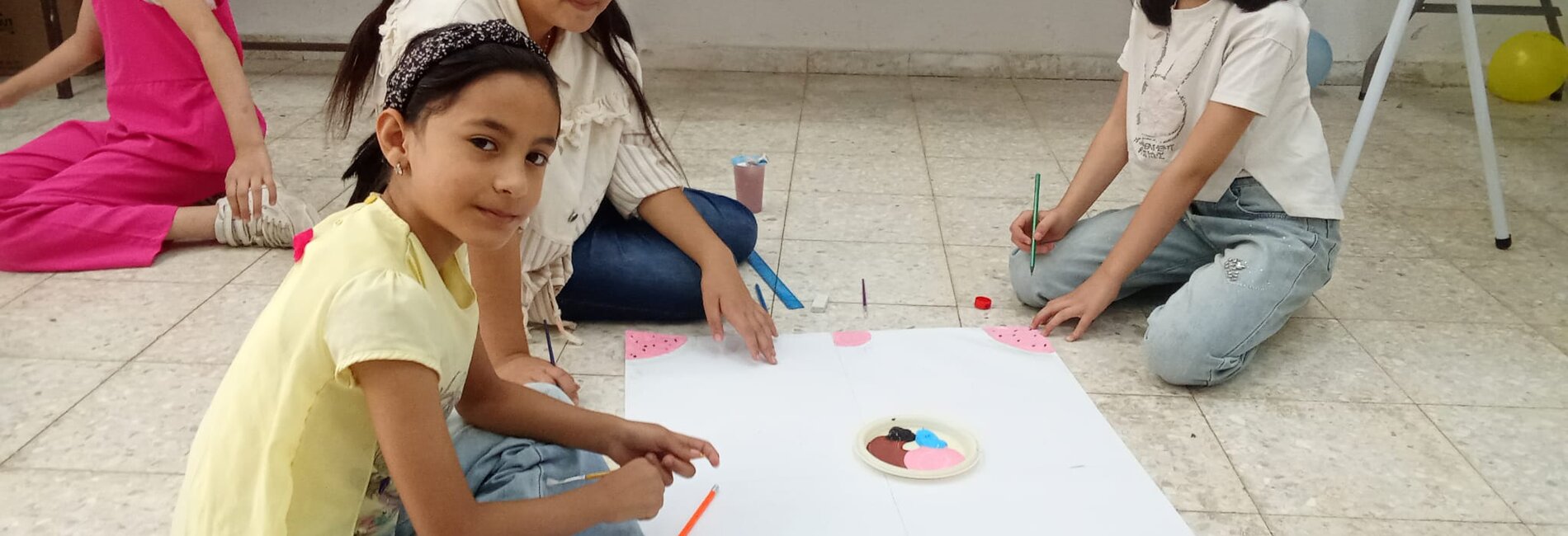 Sara engaging with her peers during a Social and Emotional Learning (SEL) and Psychosocial Support (PSS) session held in the summer of 2025. The session focused on helping children recognize, express and manage their emotions, supporting their emotional well-being and resilience.