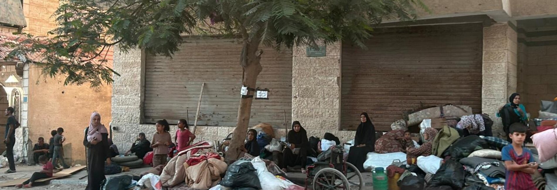 Newly displaced people in Gaza city, just hours after leaving an area of Ar Rimal neighbourhood following a warning by the Israeli military that its forces would attack a high-rise tower nearby. Photo by OCHA