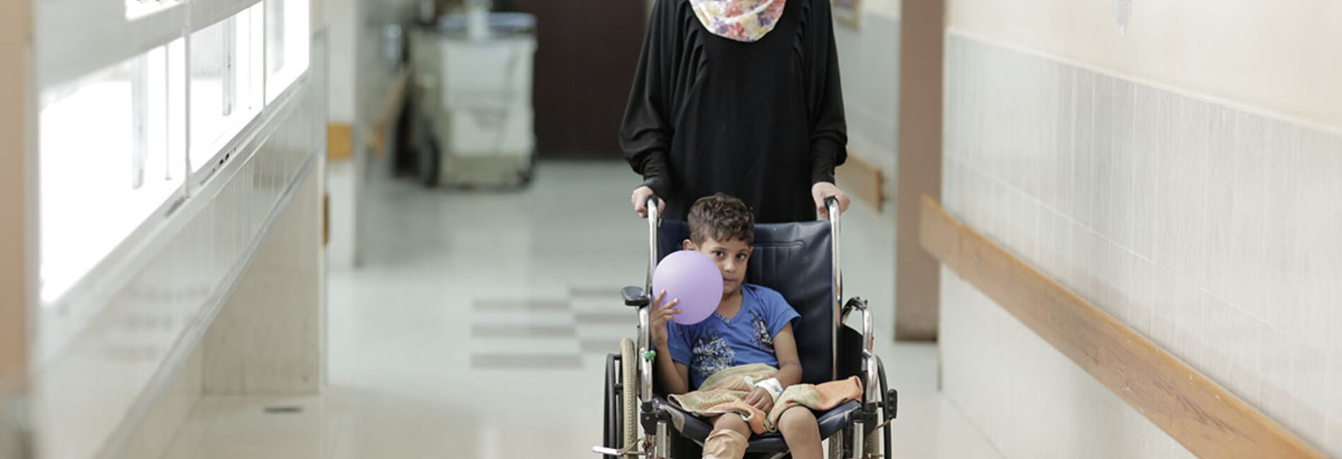 A mother and son in the orthopedic department at Ash Shifa hospital, Gaza City, October 2015