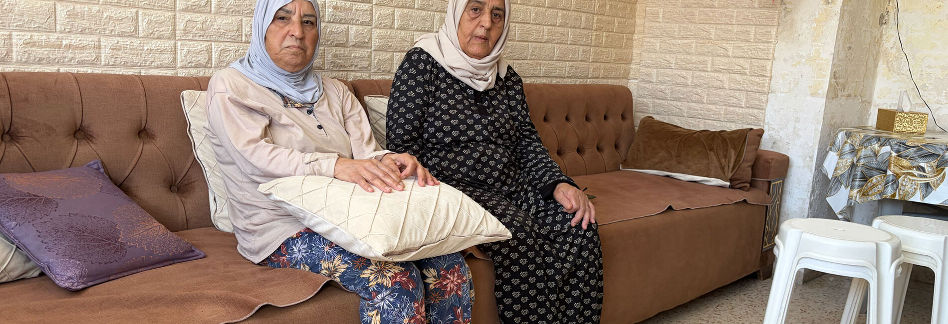 Rabe'a and An'am Maragha, Palestinian residents of Silwan, East Jerusalem. Settlers took over part of their apartment and the upper floors after Israeli forces evicted their relatives. “They tore our family apart,” one of them said.