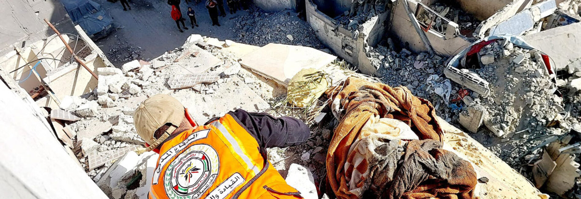 A Civil Defence team member works to safely dismantle a wall at risk of collapse in a high-rise building struck during hostilities in Rafah, Gaza's most densely populated area, where a large number of displaced people are seeking relative safety. Photo by the Civil Defence, 10 January 2024. 