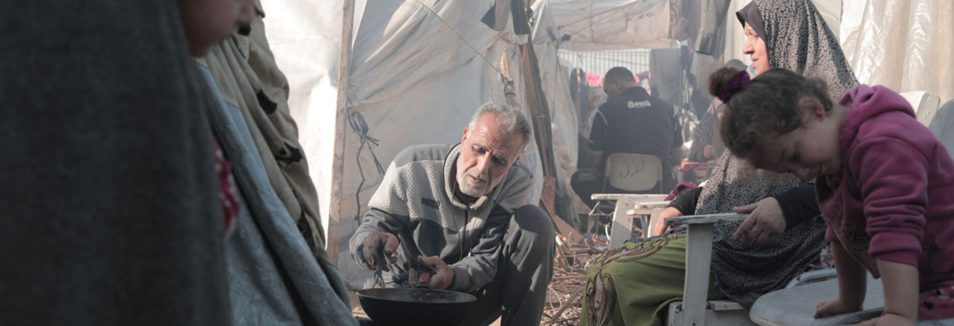 A displaced family in the Gaza Strip. On 12 January, the UN Emergency Relief Coordinator Martin Griffiths warned that “more and more people are being crammed into an ever-smaller sliver of land, only to find yet more violence and deprivation, inadequate shelter and a near absence of the most basic services.” Photo by UNRWA