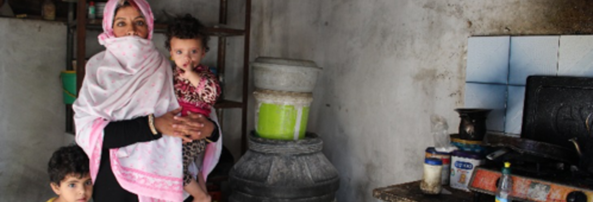 Mona and two of her seven children, in a poor household affected by electricity and water shortages. Rafah, Gaza Strip, October 2017. © Photo by OXFAM