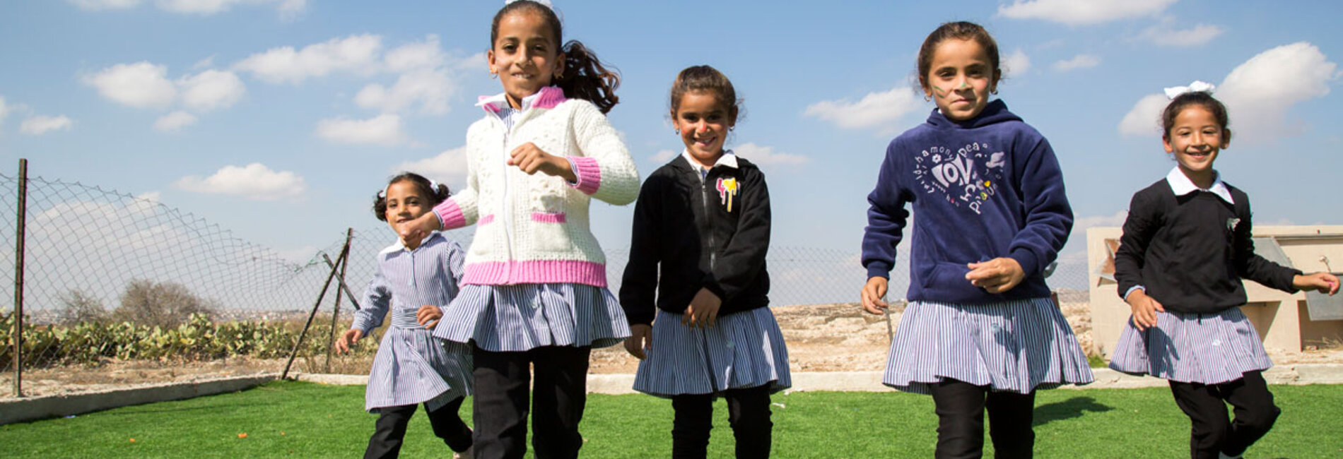 Banan, Laila and Hadeel all 8-year-old happily playing at one of the UNICEF Supported schools in southern Hebron. Photo by UNICEF