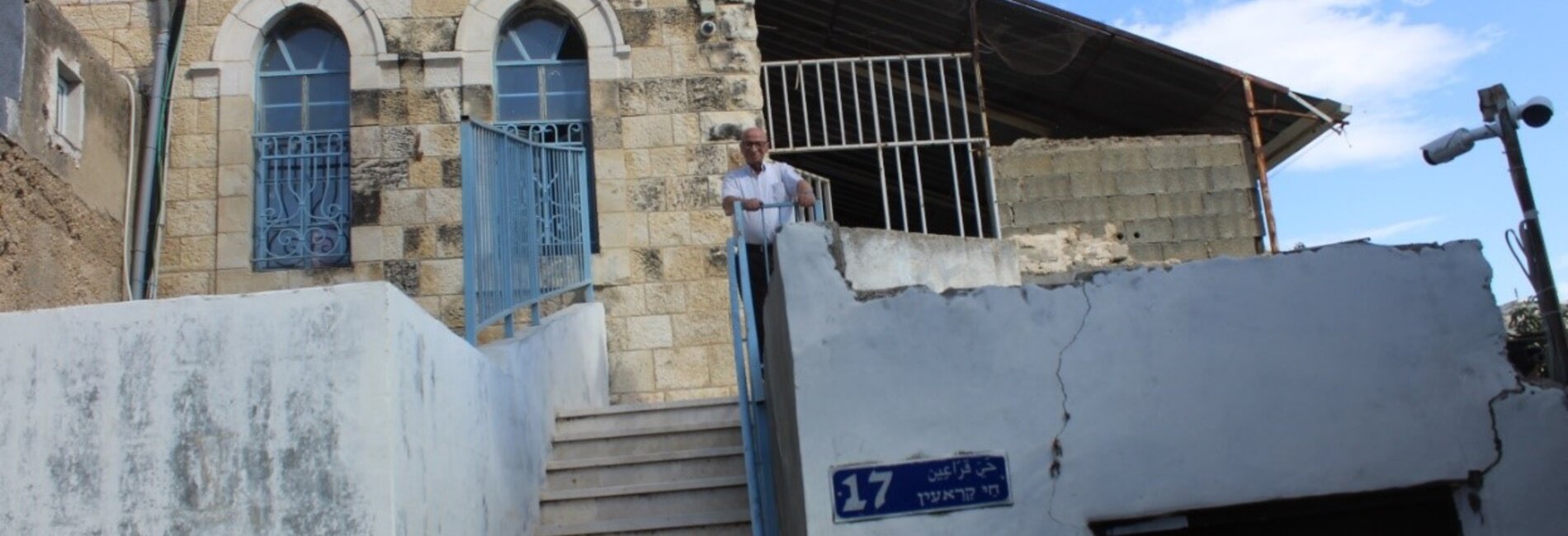 Mr. Salah in front of his family home from which he was evicted. Photo by OCHA