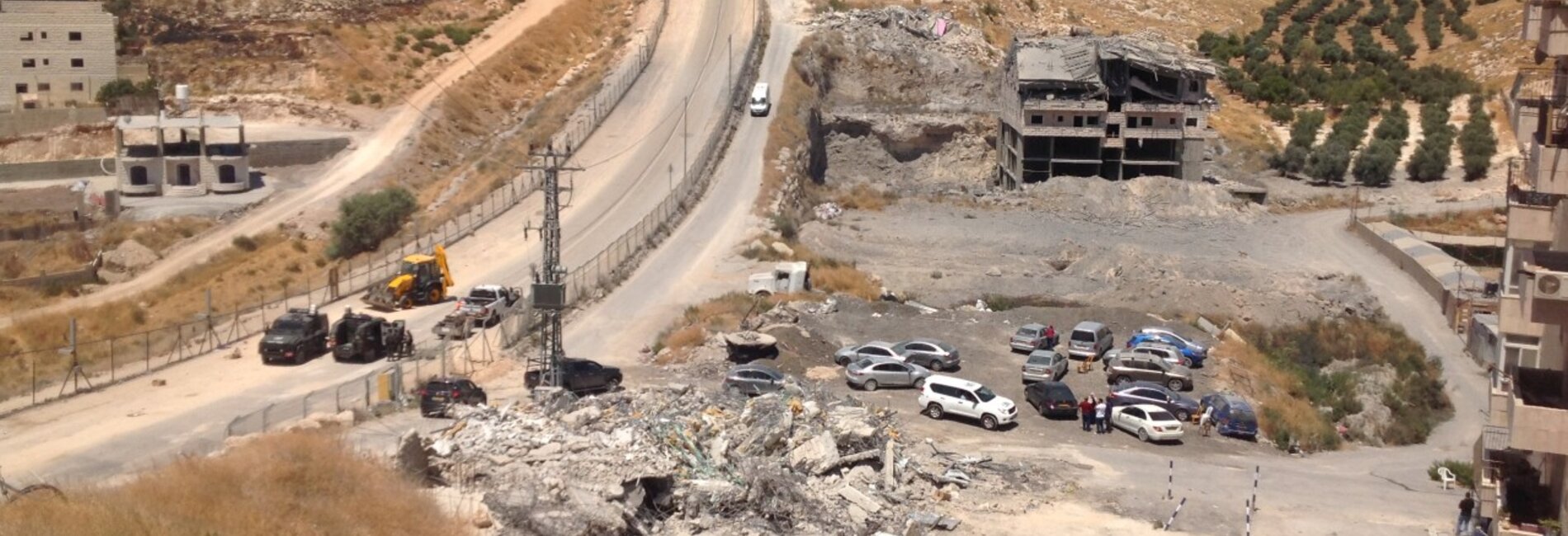 Buildings in Sur Bahir demolished on 22 July 2019 next to the security road along the Barrier. ©  Photo by OCHA