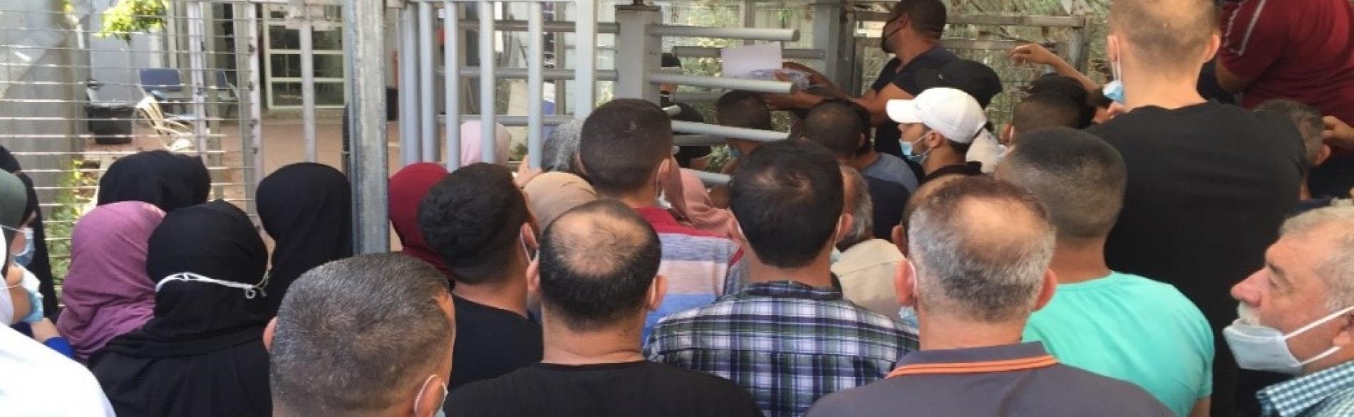 Farmers waiting at the entrance of Qalqiliya DCL to apply for ‘Seam Zone’ permits, 16 Sep 2020.