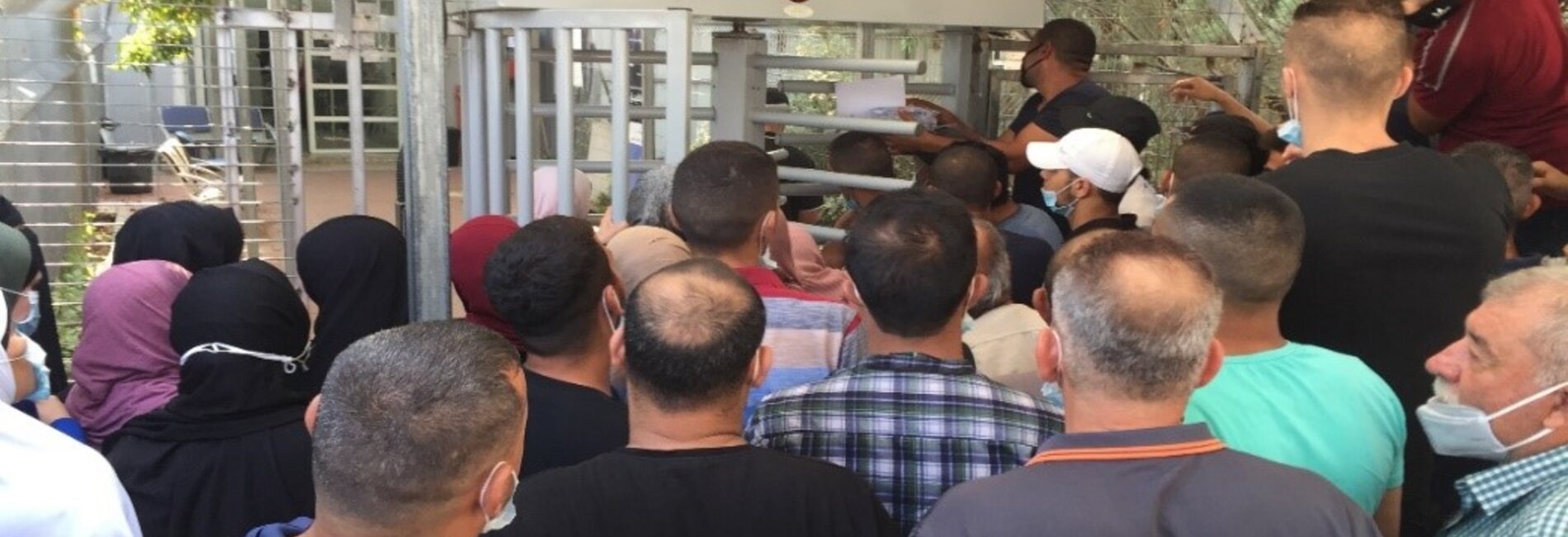 Farmers waiting at the entrance of Qalqiliya DCL to apply for ‘Seam Zone’ permits, 16 Sep 2020.