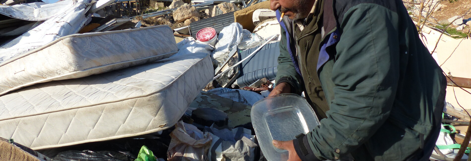 Salem from Jabal al Baba between the rubble of his demolished house , January 2017. © Photo by OCHA