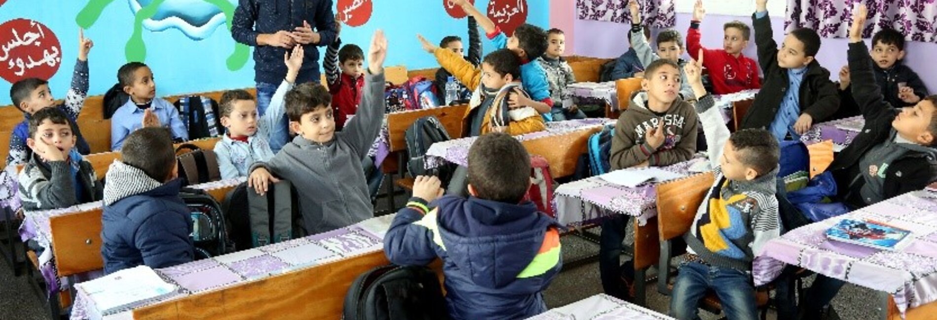 Students at Al Bahrain Elementary Boys School continue their lessons after UNMAS clearance, October 2019. Photo by Khalil Adwan.