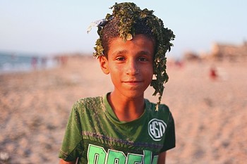 Palestinian boy after swimming in a polluted beach in Deir al Balah Camp, Gaza. © Photo Credit: Rehaf Batniji/OXFAM 2018 Palestinian boy after swimming in a polluted beach in Deir al Balah Camp, Gaza. © Photo Credit: Rehaf Batniji/OXFAM 2018