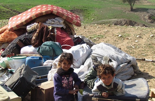 Children of a herding community with belongings after Israeli authorities demolished their structures in Ein al Hilwa (Tubas Governorate) in the Jordan Valley on 30 January 2014. Credit: OCHA Children of a herding community with belongings after Israeli authorities demolished their structures in Ein al Hilwa (Tubas Governorate) in the Jordan Valley on 30 January 2014. Credit: OCHA