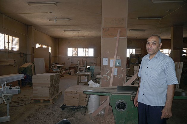 Mujahed al Sousy in his furniture  workshop, June 2017. ©  Photo by OCHA.