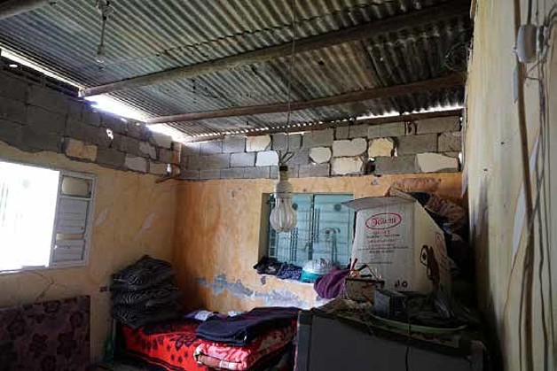 Damaged house of Kishko’s family, Gaza city, March 2018. ©  Photo by OCHA