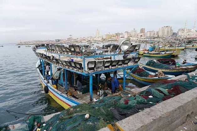  Fishing boat equipped with a lightening system to attract fish. Gaza city’s port, March 2018 ©  Photo by OCHA