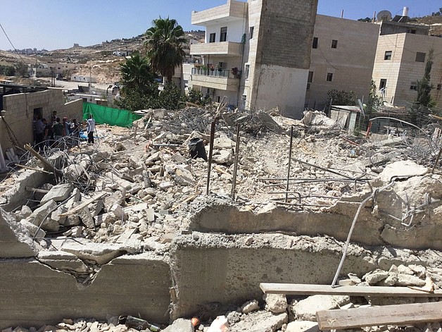 Demolition of a residential building under construction in Al ‘Isawiya in East Jerusalem on 15 August. Photo by OCHA.