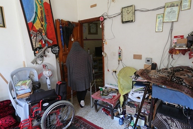 Kafaiah's toes are amputated and she needs walking support, while her husband is paralyzed. 3 December, 2020, Gaza City. Photo by GPC Kafaiah's toes are amputated and she needs walking support, while her husband is paralyzed. 3 December, 2020, Gaza City. Photo by GPC