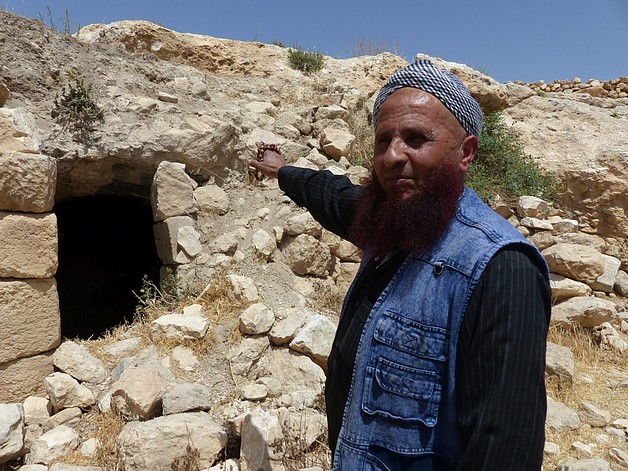 Khaled al ‘Amoor outside his destroyed cave in Sarura, May 2017. ©  Photo by OCHA.