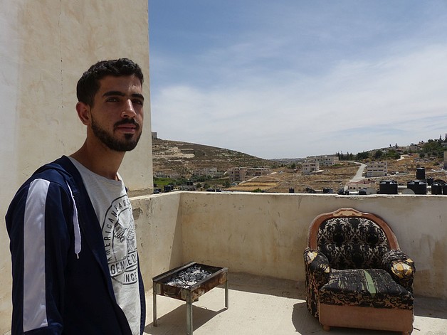 Mohammed al Ammasi at the lower rooftop of his house in al Fawwar, May 2017. ©  Photo by OCHA.