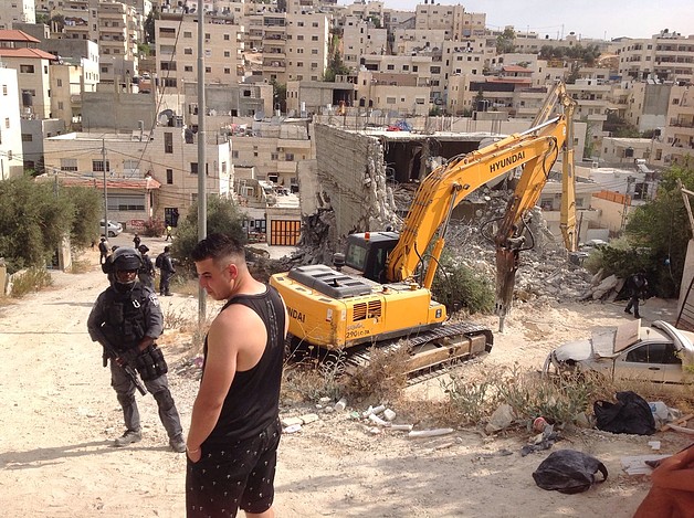 Demolition of a four-storey building in Al-’Isawiya in East Jerusalem. 11 July 2017. © Photo by OCHA