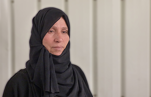 Fatma Saudi, a widow from Ash Shuja'iyeh, one of the areas worst affected in the summer hostilities. January 2015. Photo by OCHA