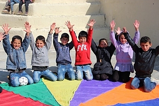 Children enjoying their time during a Psychological First Aid activity through a critical thinking game in Susiya. Photo by Jumana Rishmawi ©World Vision 2018