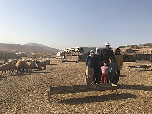 Bisharat family, standing in front of their residence which is at imminent threat of demolition, Makhul, 18 October 2017. © Photo by OCHA