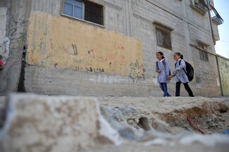 13 Children on their way to school, Ash Shuja’iyeh, Gaza. 2015 UNRWA Photo by Ahmad Awad