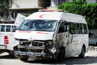Destroyed PRCS ambulance, July 2014. Photo by OCHA