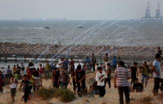 Palestinian demonstration on the beach near the fence, protesting against the naval blockade, September 2018. ©  Photo by Ashraf Amra