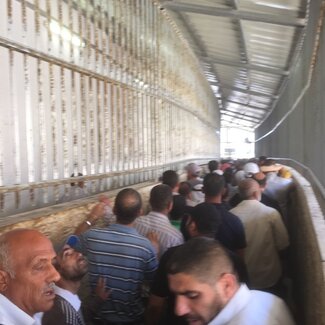 Gilo checkpoint, Palestinians accessing East Jerusalem for the Ramadan Friday prayer, 3 July. Photo by OCHA.