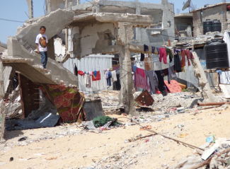 IDPs living makeshift in shelters next to their destroyed homes, Beit Hanoun. Photo by OCHA