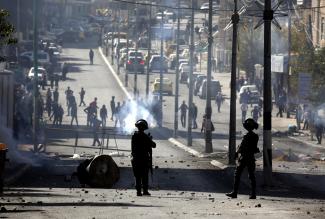 Clashes between Palestinians and Israeli forces during a protest against the US recognition of Jerusalem as Israel’s capital, Bethlehem,12 December 2017. 