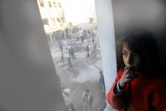 Girl looking at destruction site after Gaza 2008-2009 conflict, February 2009. © Photo by UNICEF